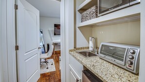 A kitchen with a built-in microwave, a toaster, and a sink. - Waterfront Home w/ 3 Decks, Fire Pits and Hot Tub! (Terry)