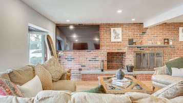 TV, fireplace, books