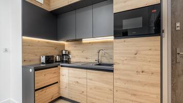 Apartment, 1 Bedroom, Balcony, Beachside | Private kitchen | Microwave, dishwasher, coffee/tea maker, cookware/dishes/utensils