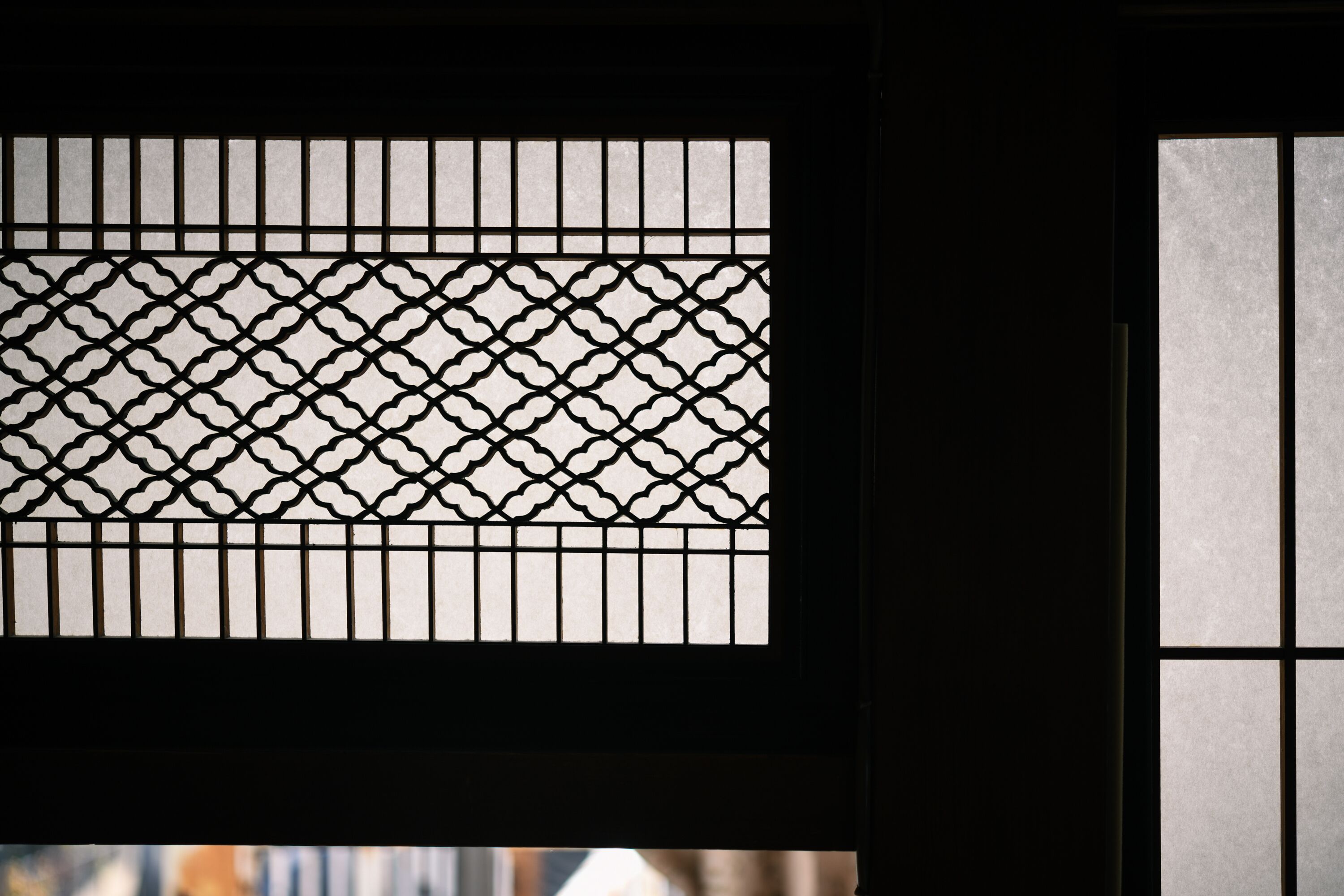 A traditional Japanese shoji screen with a geometric pattern.