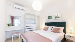 A bedroom with a bed, bedside tables, a bench, a wardrobe, and a window with curtains. - House Natura - Retreat With Tennis Court and Pool (Seget)