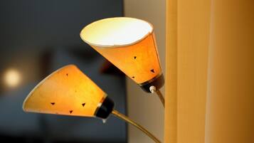 A wall-mounted lamp with a conical shade.