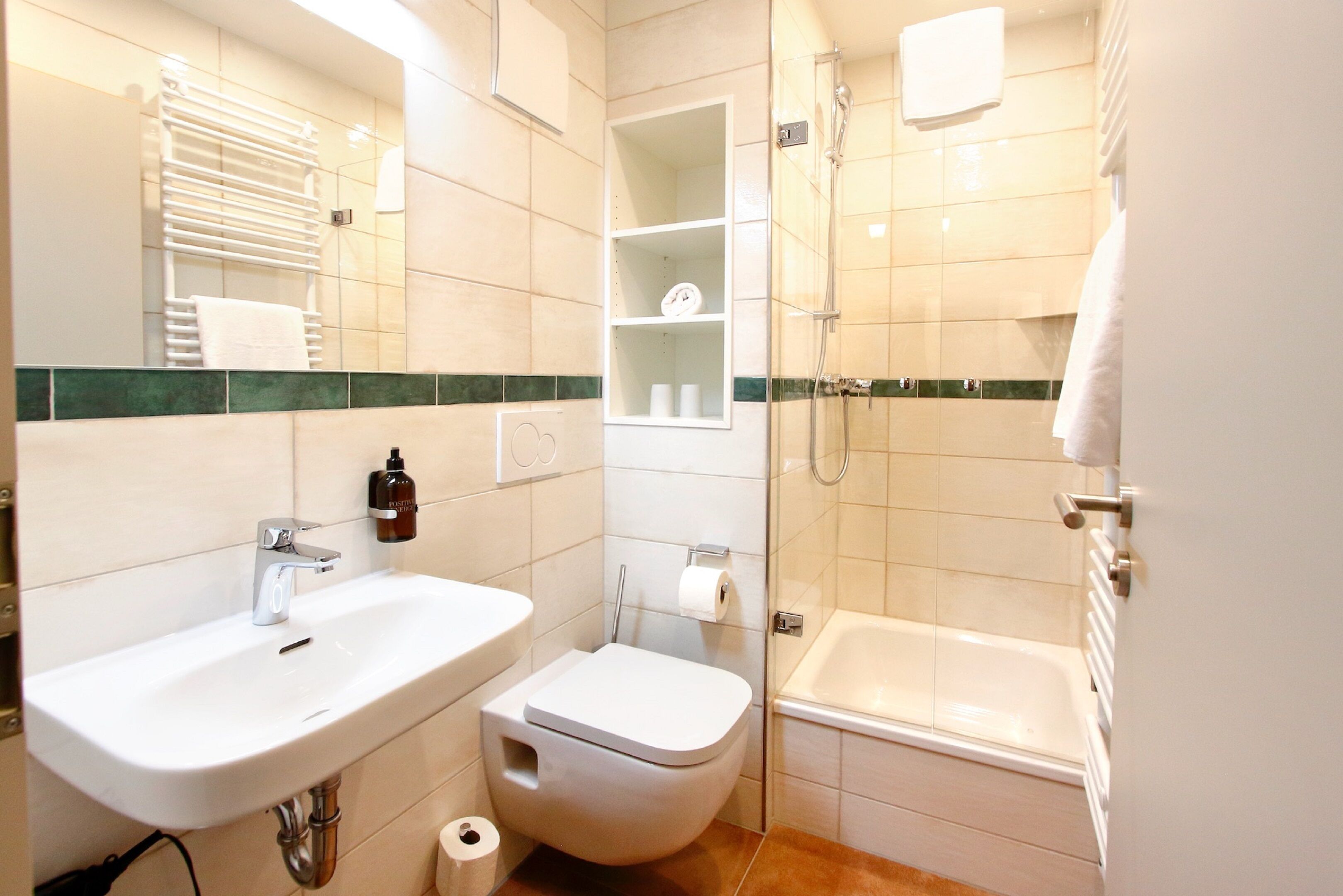 A bathroom with a sink, toilet, and bathtub.