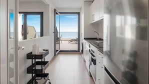 A modern kitchen with a large refrigerator, a sink, and a window overlooking a balcony. - Panoramic Terrace w/pool by Costarentals - Ref 43 (Benalmádena)