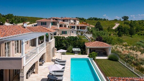A large villa with a swimming pool, multiple balconies, and a well-maintained garden. - Villa Monte by Villas Guide (Vižinada)