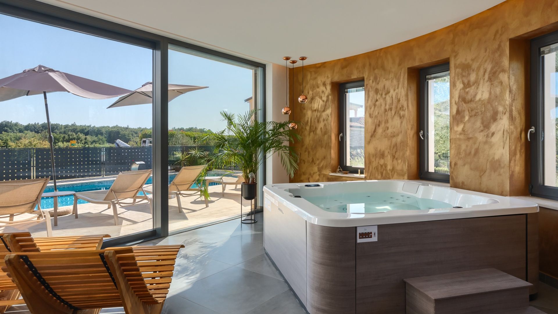 A modern bathroom with a bathtub, a shower, and a large window.