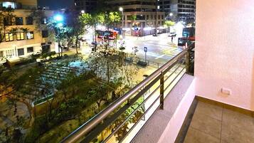 Enjoy the city view from this balcony overlooking the urban landscape.