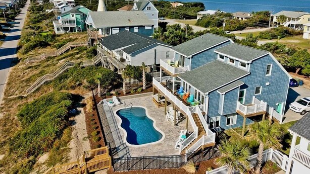 A coastal residential area with houses, a swimming pool, and a water tower. - Dark and Stormy, Almost Oceanfront House in Emerald Isle, NC! (Emerald Isle)