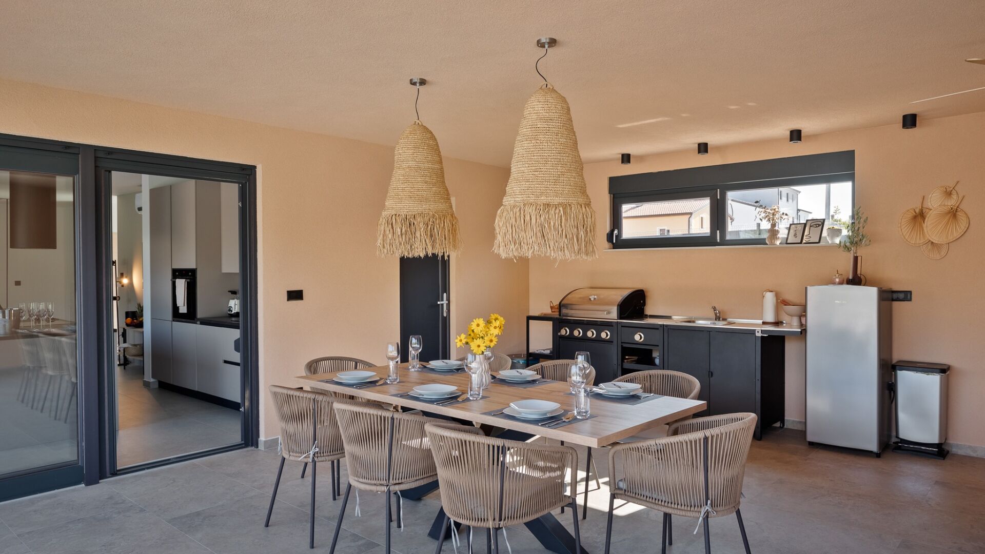 A modern kitchen with a dining area.