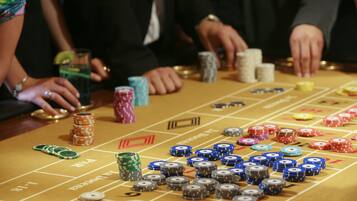 A craps table with chips and dice, indicating a casino setting.