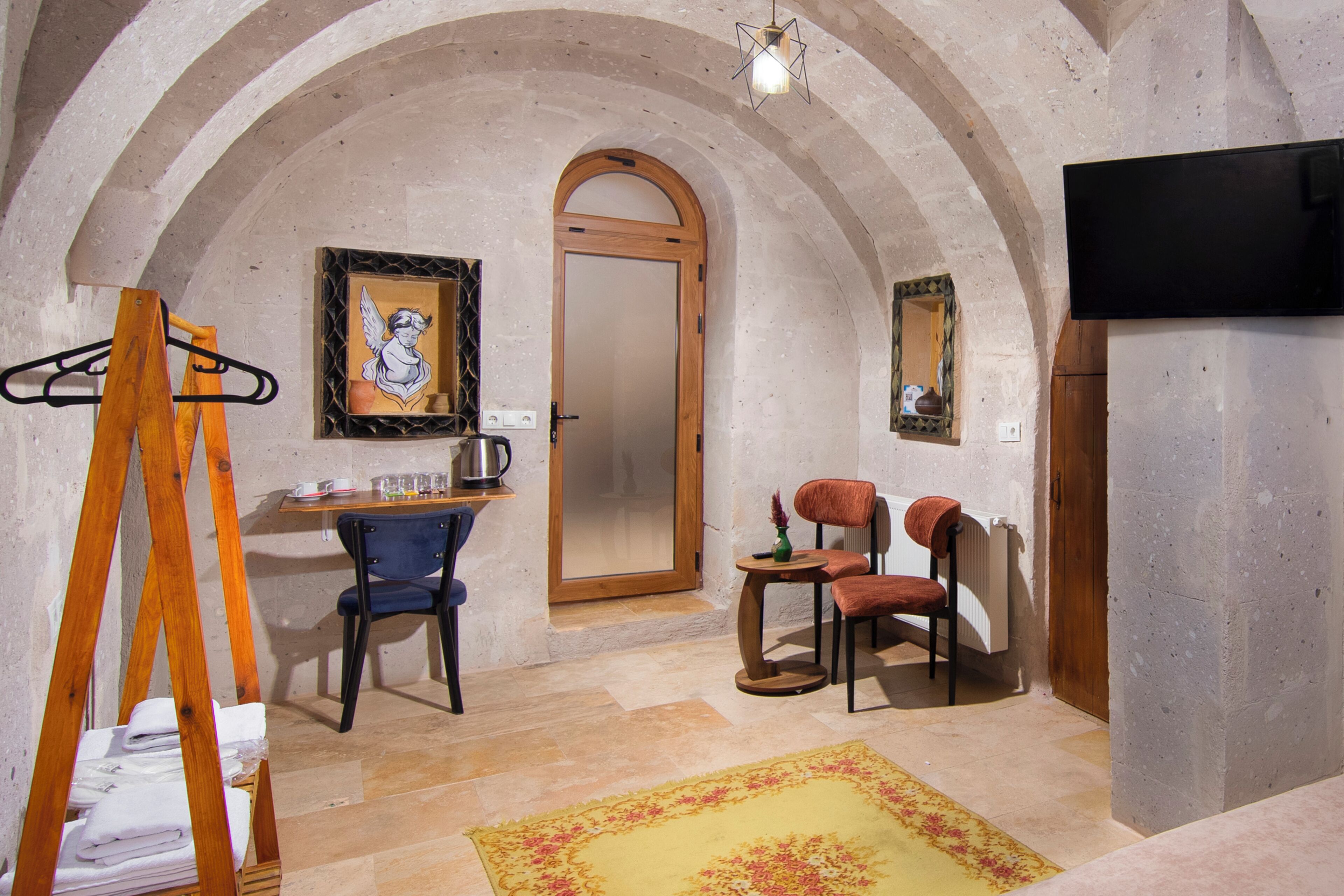 Family Triple Room | Living area | 32-inch LED TV with satellite channels