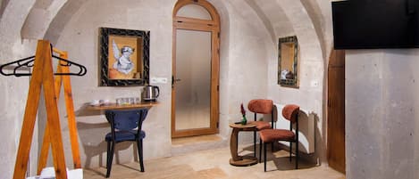 Family Triple Room | Living area | 32-inch LED TV with satellite channels