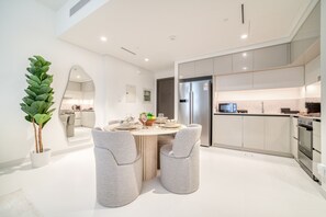 Enjoy casual dining and cooking in this well-equipped kitchen with a central island and appliances.