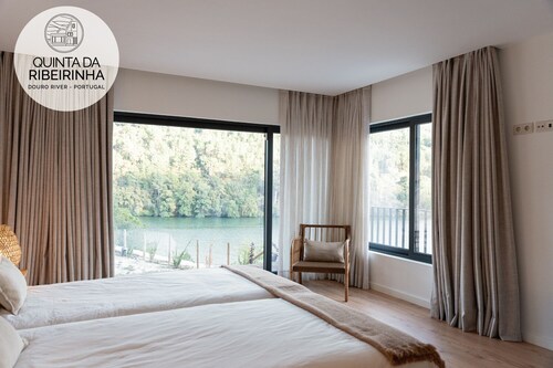 Modern house near waterfall with fluvial beach and amazing view over Douro river