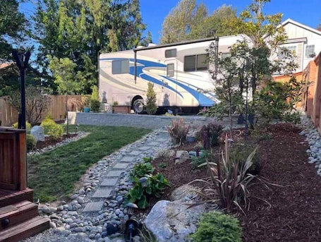 Property grounds. Quiet Backyard Class A Motorhome. Near Airport and Light Rail