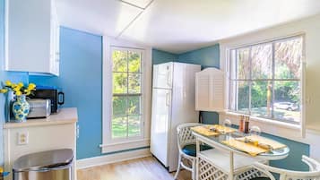 Fridge, microwave, coffee/tea maker, cookware/dishes/utensils