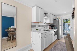 Microwave, coffee/tea maker, cookware/dishes/utensils