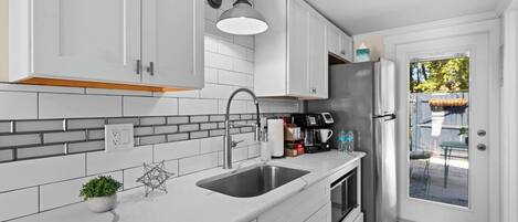 Microwave, coffee/tea maker, cookware/dishes/utensils