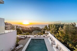 Relax by the rooftop pool with unobstructed ocean views.
