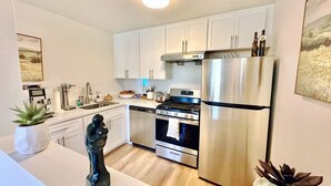 Coffee/tea maker, fridge, microwave, oven