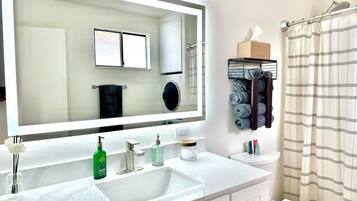 Eco-friendly toiletries, hair dryer, towels