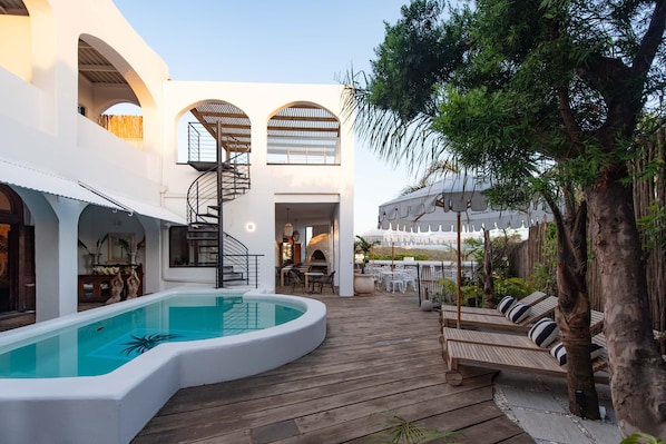 Outdoor pool, open 7:00 AM to 10:00 PM, pool umbrellas, pool loungers