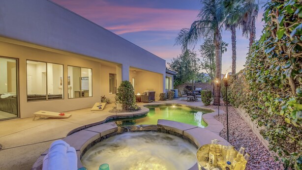 A modern house with a swimming pool, a hot tub, and a patio area. - Serenity: Pool,Spa, Gated Community and Fun! (La Quinta)