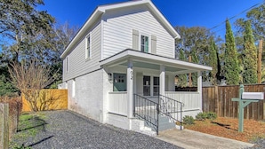 A two-story house with a front porch, a visible mailbox, and a gravel driveway. - Renovated - Old Village - Close to Beach/Downtown (Mount Pleasant)