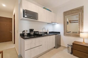 Fridge, microwave, stovetop, coffee/tea maker