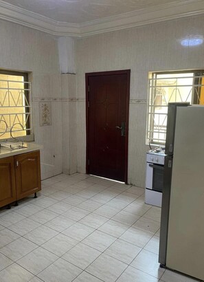 Fridge, microwave, cookware/dishes/utensils, cleaning supplies