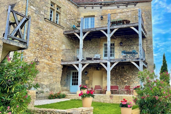 View of Maison Delluc with its double balconies offering stunning vistas