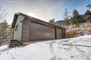 A log cabin with a garage labeled "Moosa Road." - Moose Manor  (Cascade)