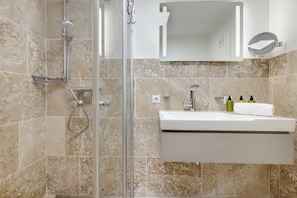 Shower, hair dryer, towels, soap