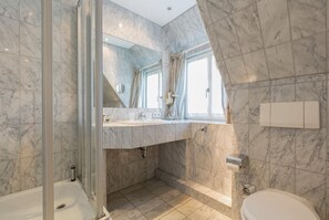 Shower, hair dryer, towels, soap