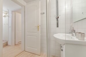 Shower, hair dryer, towels, soap