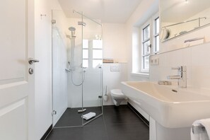 Shower, hair dryer, towels, soap