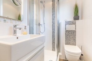 Shower, hair dryer, towels, soap
