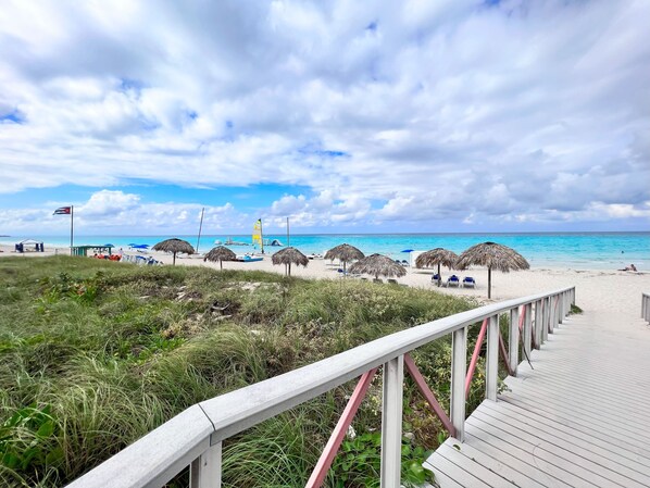 On the beach, white sand, beach towels