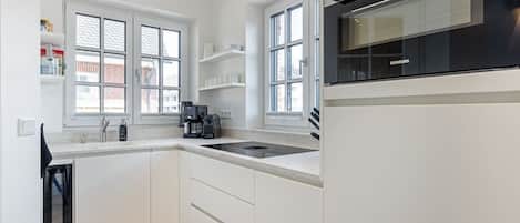 Fridge, stovetop, dishwasher, coffee/tea maker