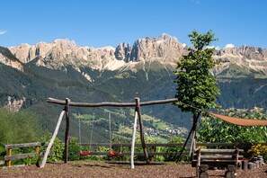 Children’s area - Apartment 'Furnerhof Apt Olpenglühn' with Mountain View, Shared Garden and Wi-Fi (Collepietra)
