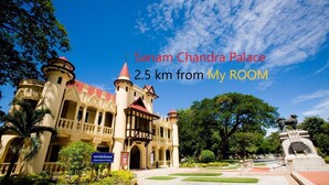 The exterior of Sanam Chandra Palace, a historical building with multiple towers and a red roof, surrounded by lush greenery. - My Room Nakhonpathom (Nakhon Pathom)