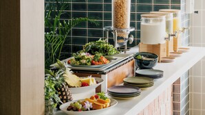 A buffet setup with various food items and beverages. - Nest Hotel Ishigaki Maesato Beach (Ishigaki)