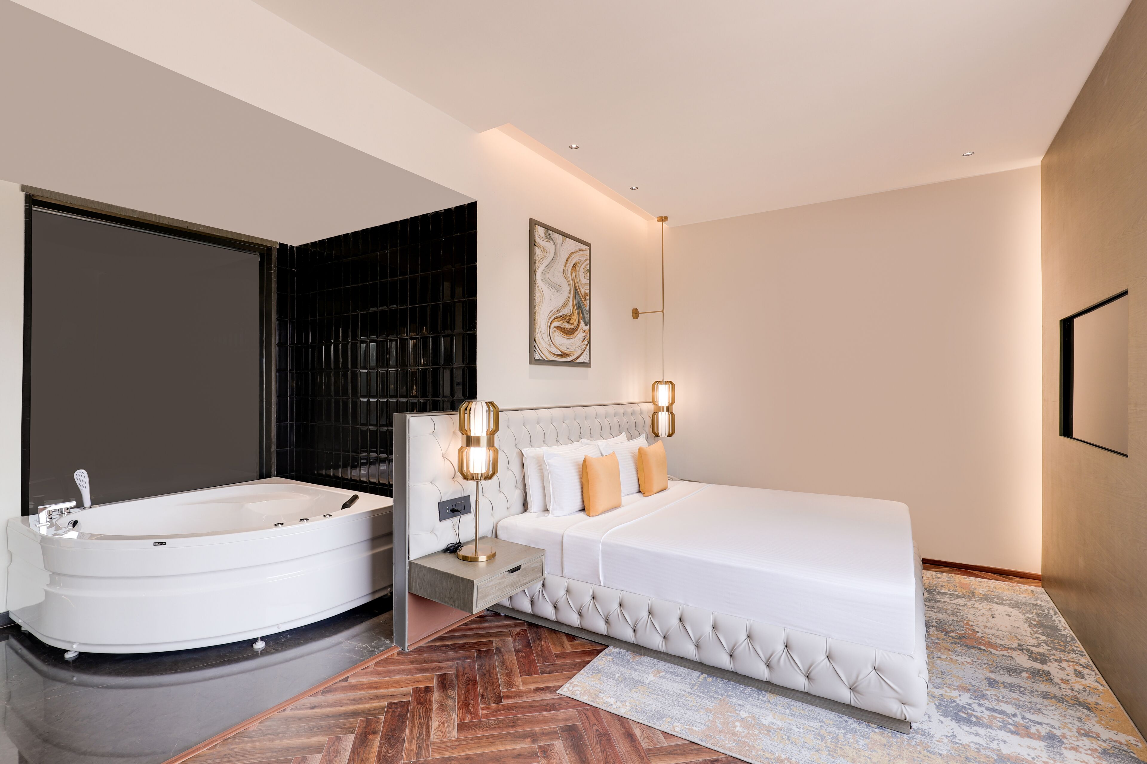 A modern bedroom with a large bed, a separate bathroom with a bathtub, and a large window.