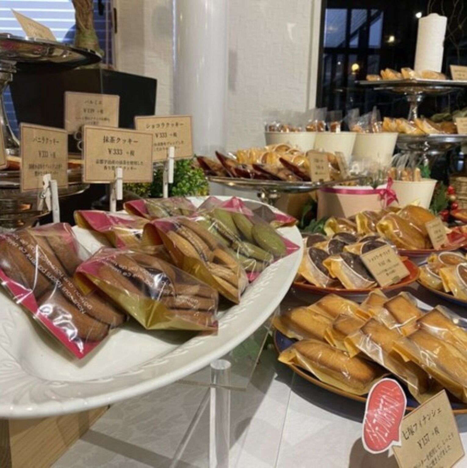 A display of packaged snacks and bread in a store.