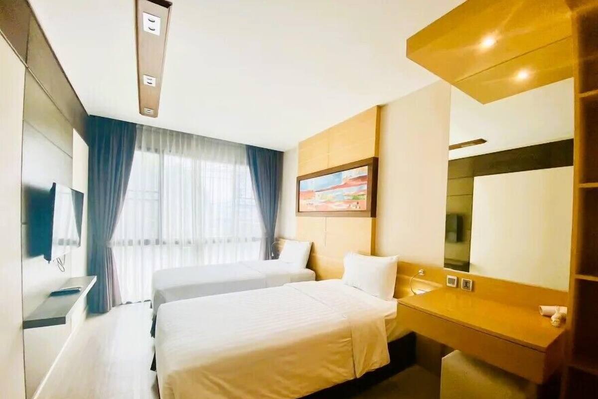 Habitació amb dos llits individuals exclusiva | Roba de llit d'alta qualitat, minibar i caixa forta a l'habitació 