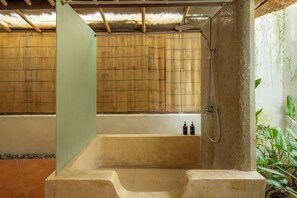Traditional Villa | Bathroom | Shower, rainfall showerhead, hair dryer, towels - Flor Villa by Betterplace (Canggu)