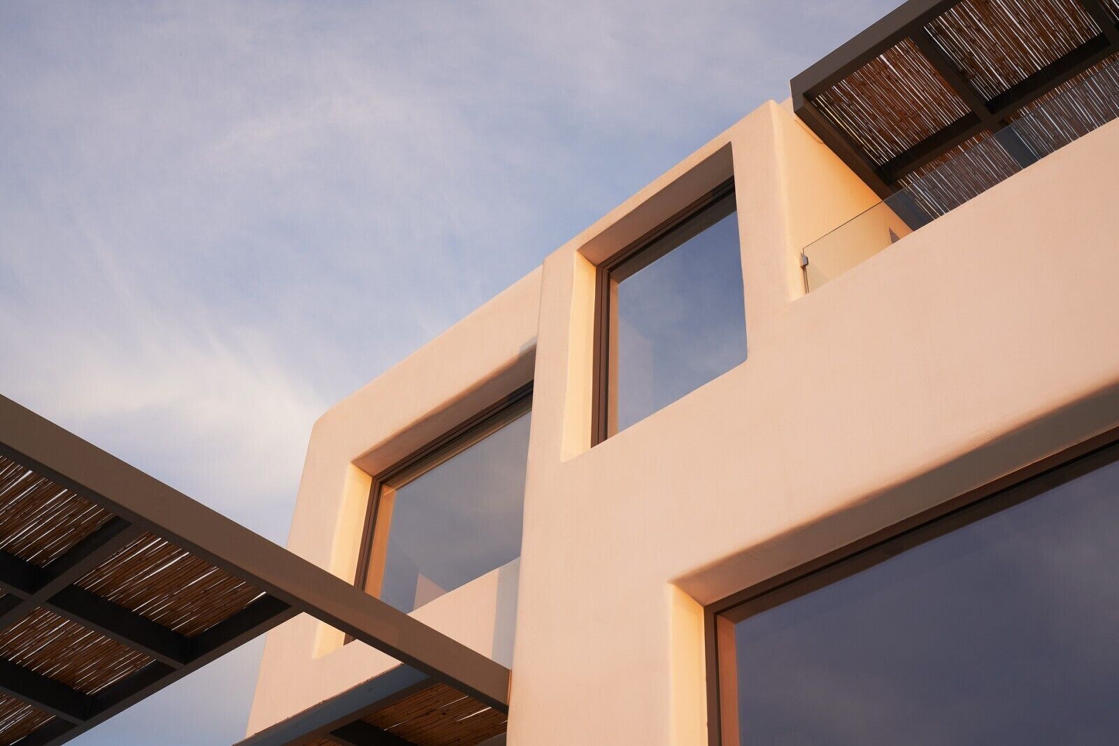 A modern building with large windows and a flat facade.
