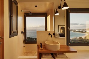 A bathroom with a large window, a sink, and a shower. - Naxea Villas I (Naxos)
