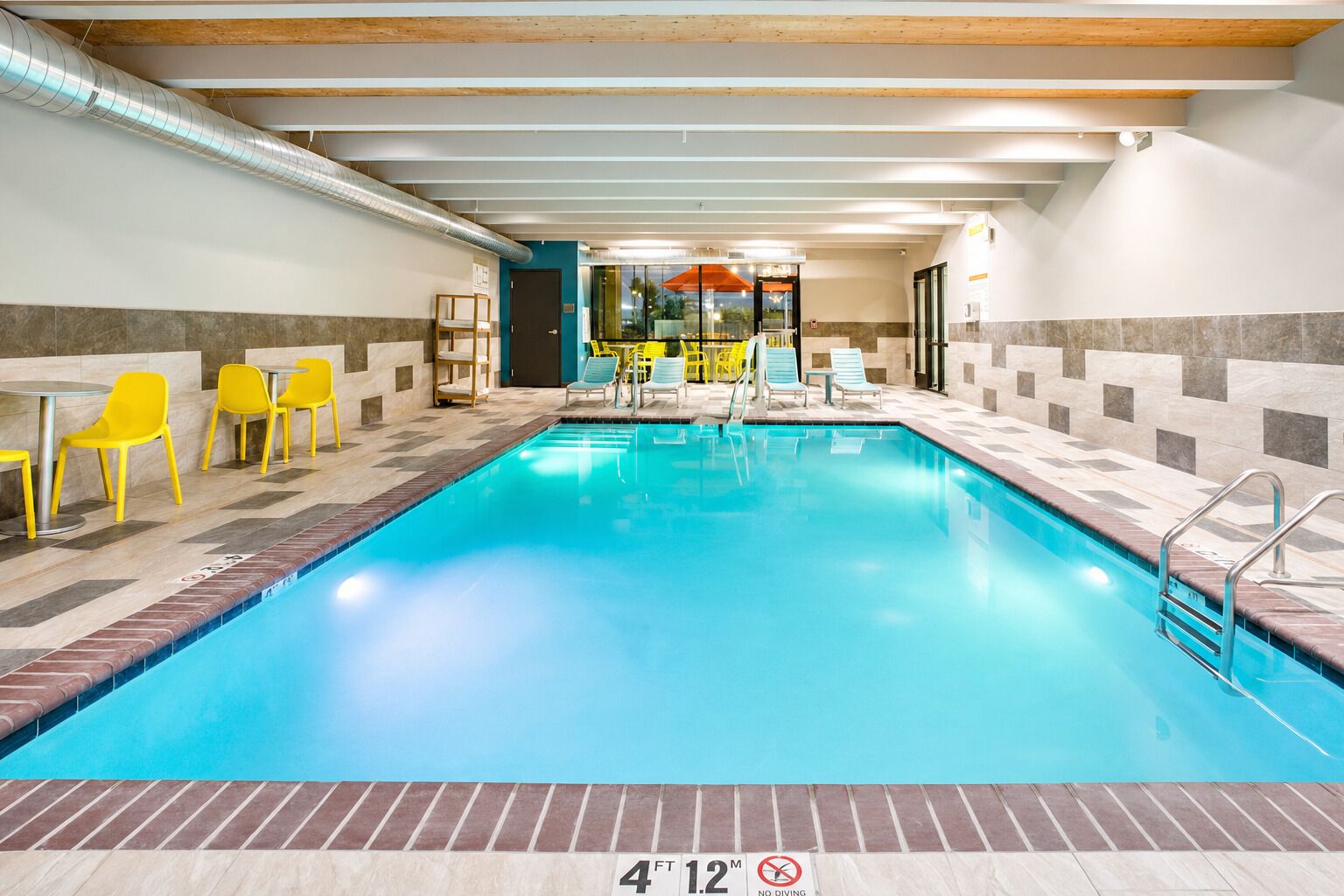Splash and relax in the sparkling indoor pool oasis.