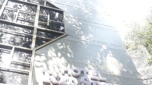 A hotel sign with the name "HOTEL RED STONE" in large letters. - Hotel Red stone inn New Delhi (New Delhi)